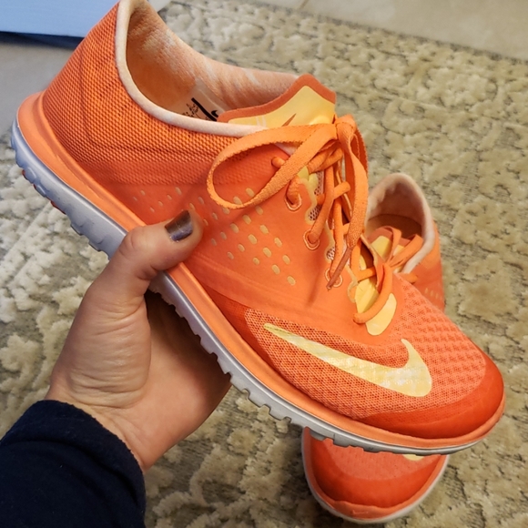 nike shoes with orange swoosh